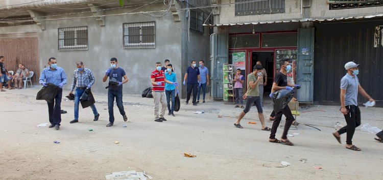 كوادر فتح بخانيونس ينفذون حملة مخيمنا جميل 